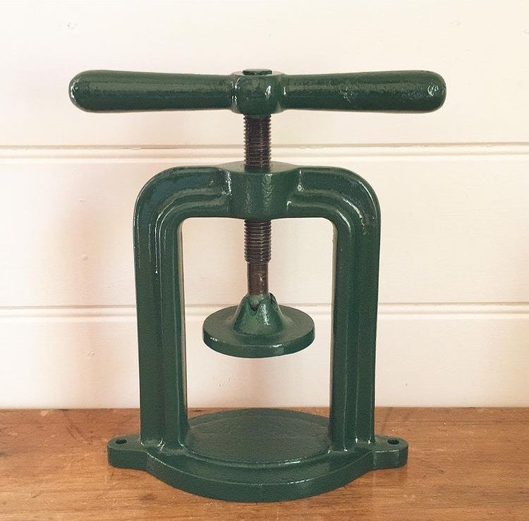 Antique cast iron press fruit press green